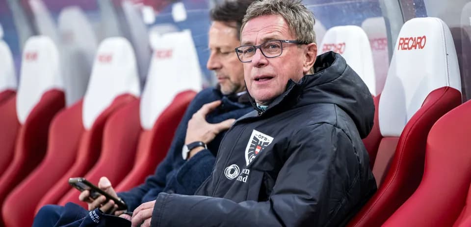 Coaches sitting on the bench during a match