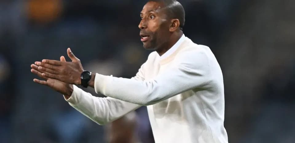 Coach giving instructions from the sidelines during match