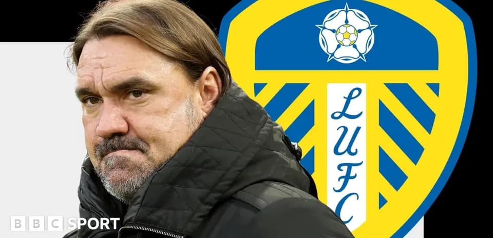 Coach in front of Leeds United club logo