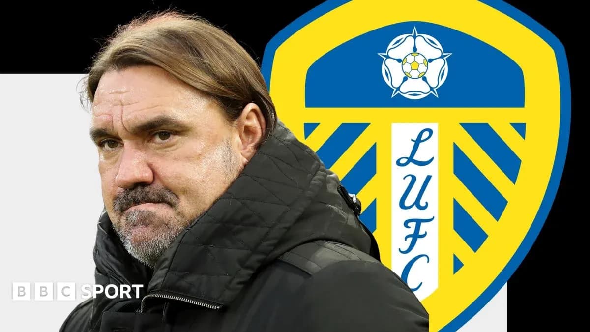 Coach in front of Leeds United club logo