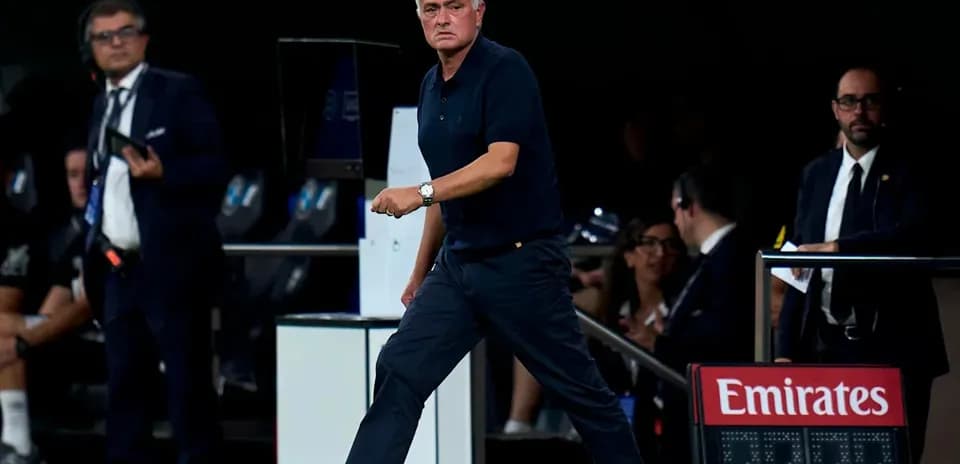Manager walking along the sidelines during match