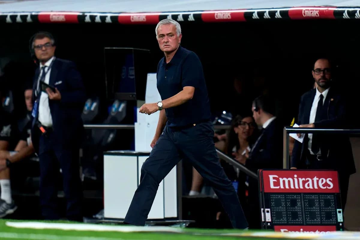 Manager walking along the sidelines during match