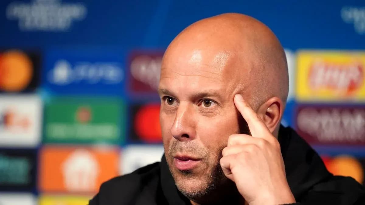 Manager speaking at press conference with UEFA backdrop