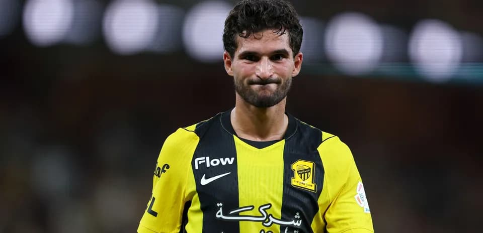 Player in yellow and black jersey during match