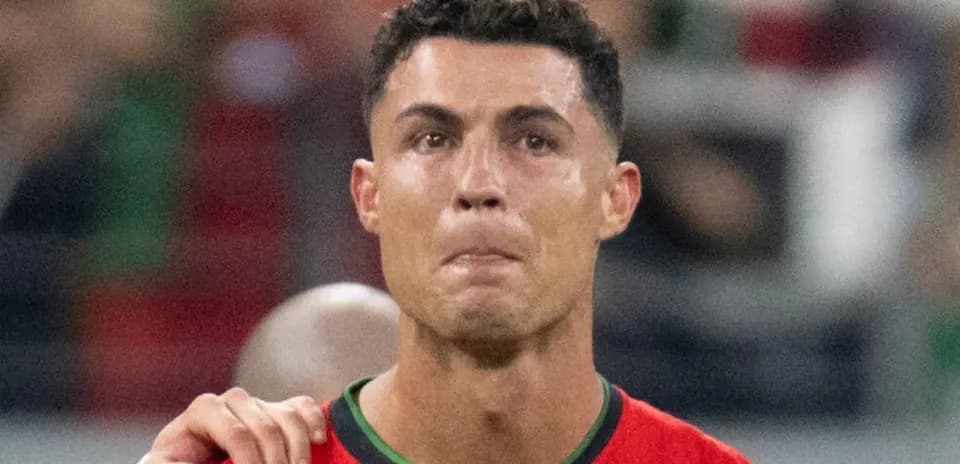 Player in red jersey during match with teammate