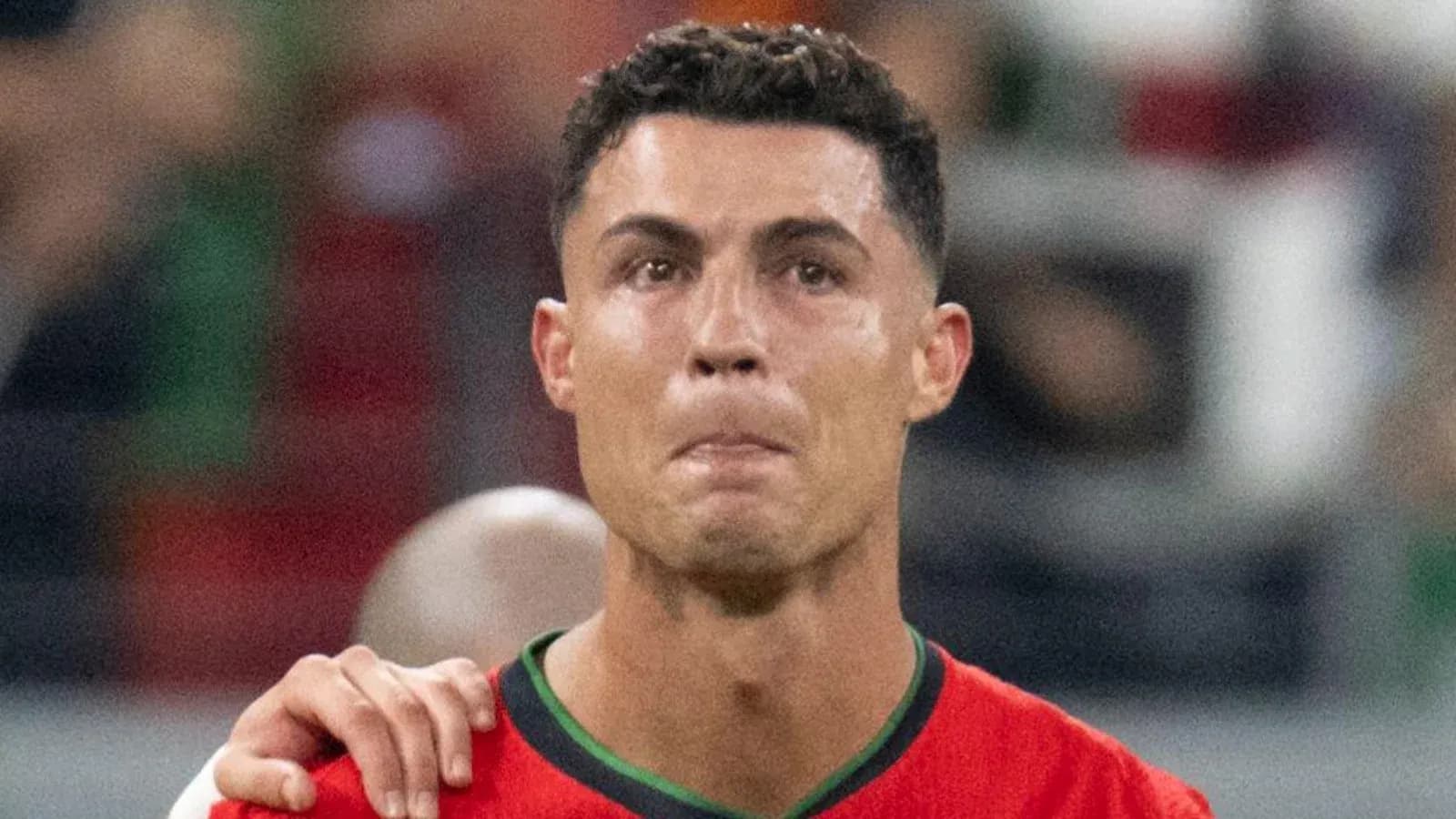 Player in red jersey during match with teammate