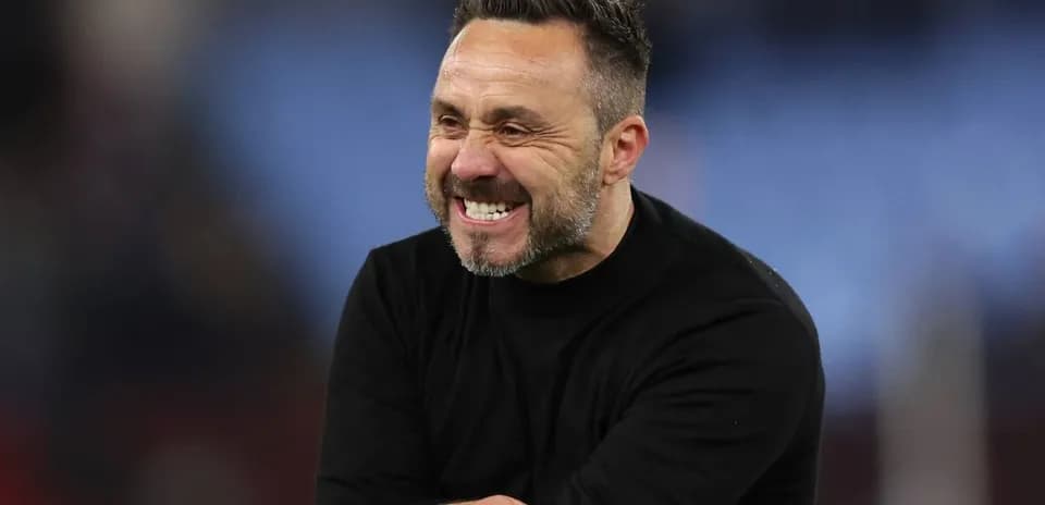 Coach celebrating on the sidelines during match