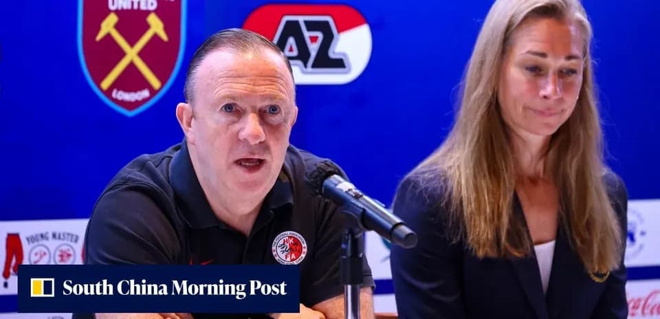 Manager speaking at press conference with assistant