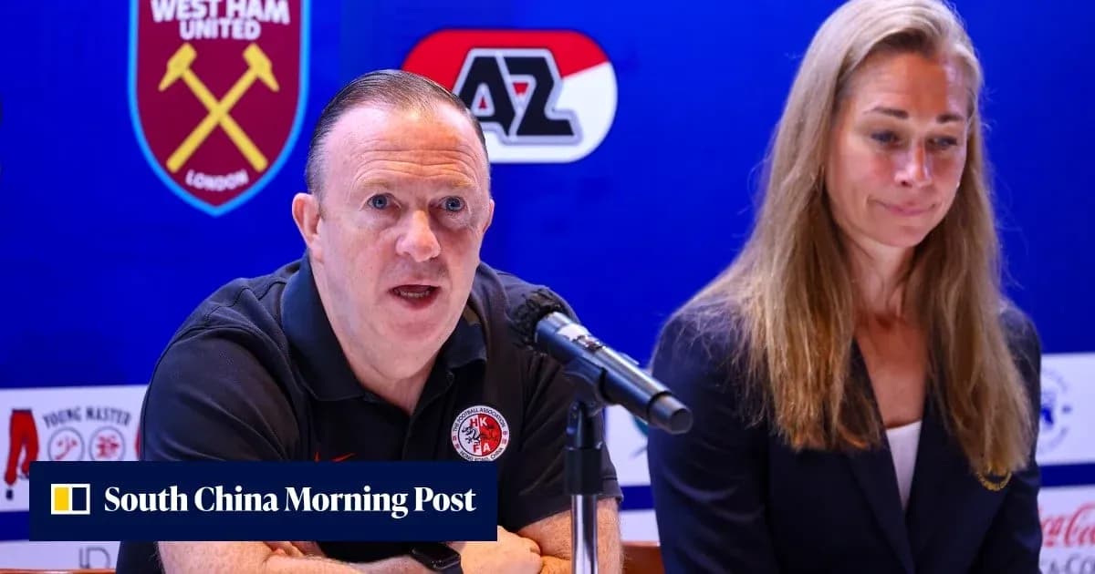 Manager speaking at press conference with assistant