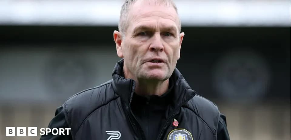 Manager in training gear during press conference