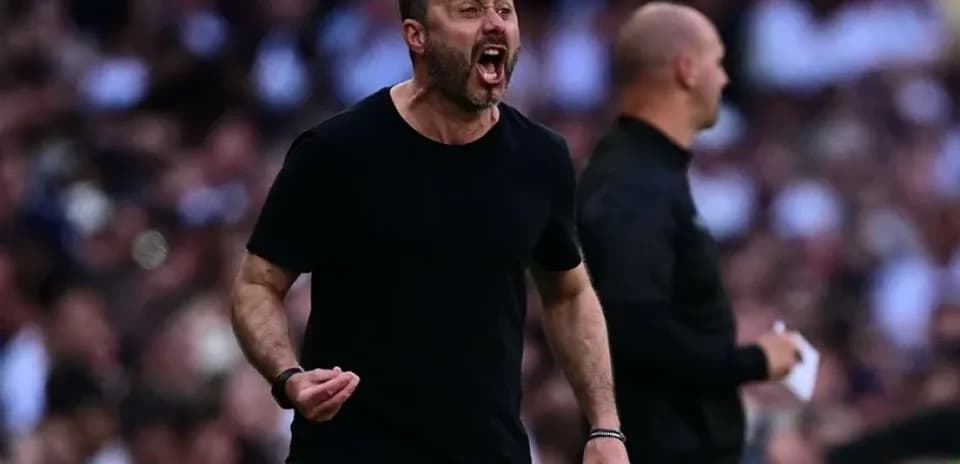 Coach passionately reacting during a match on sideline