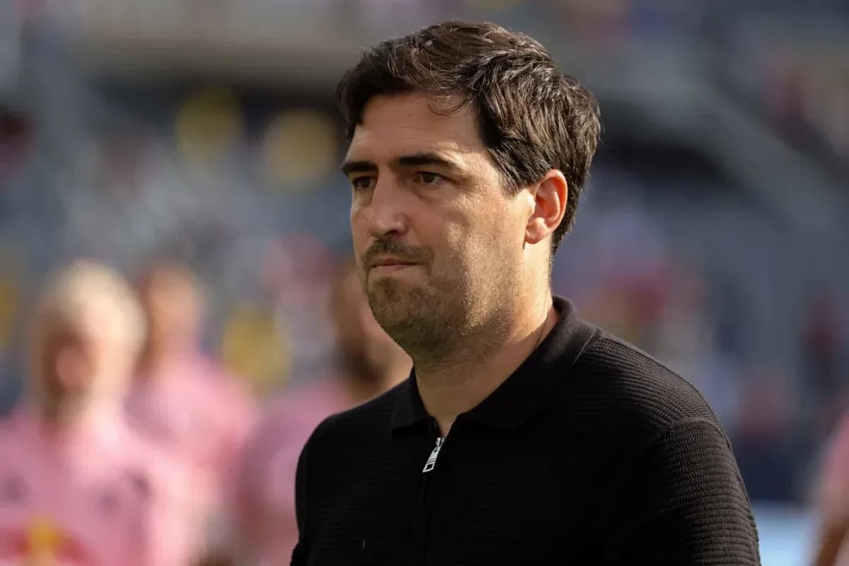 Coach observing players during a match warm-up