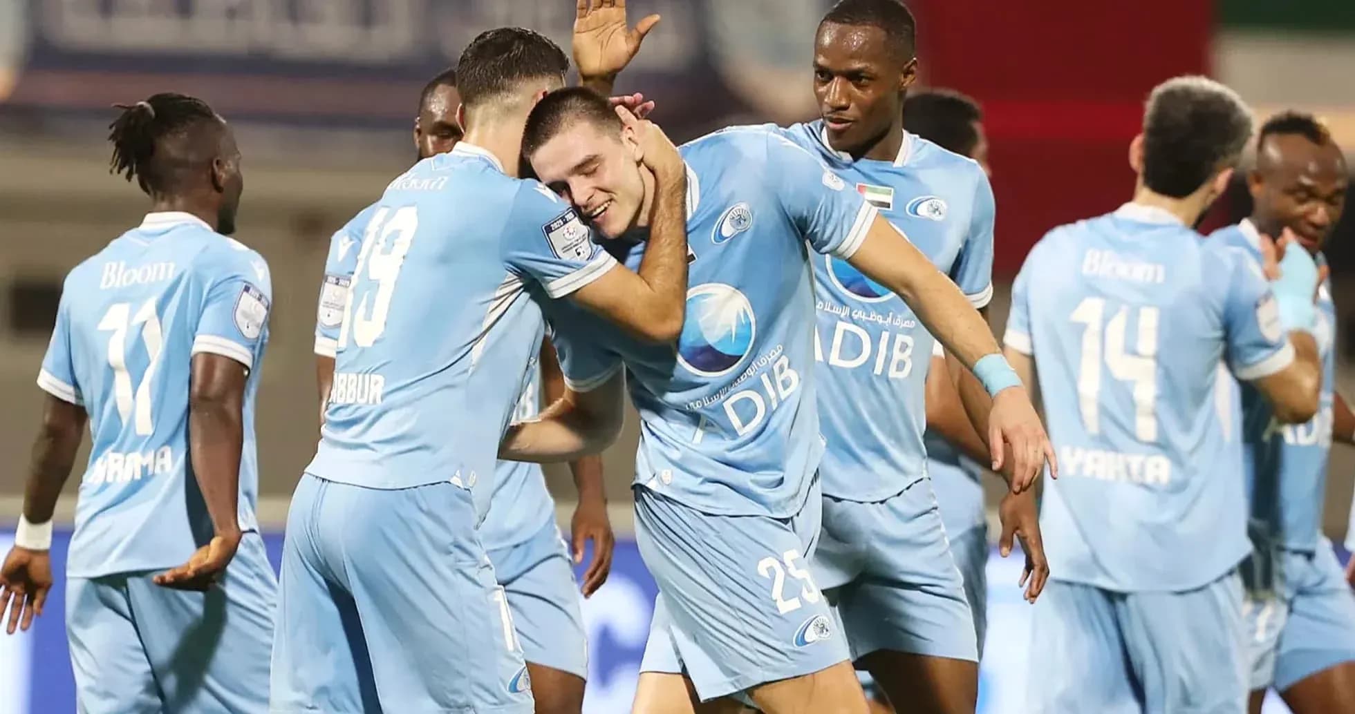 Players celebrating a goal during football match