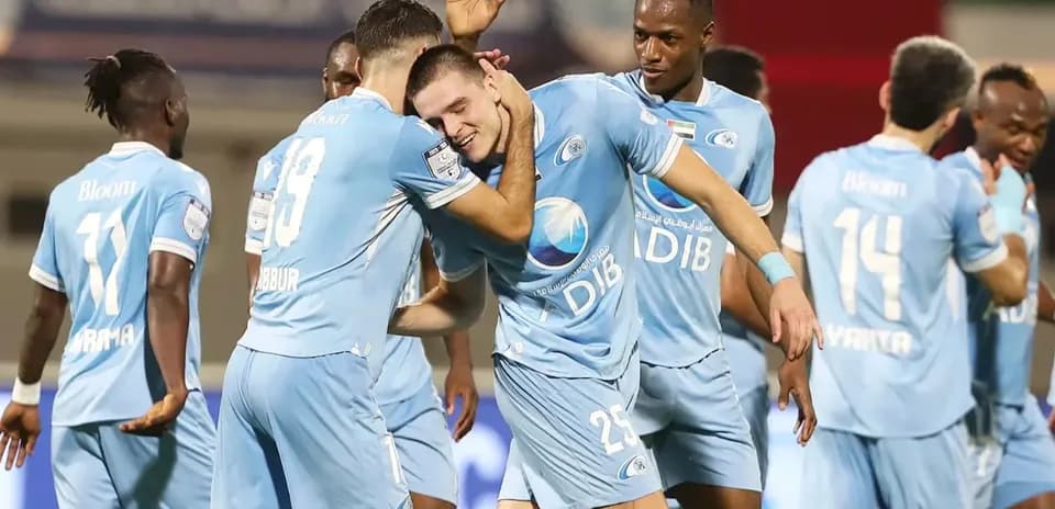 Players celebrating a goal during football match