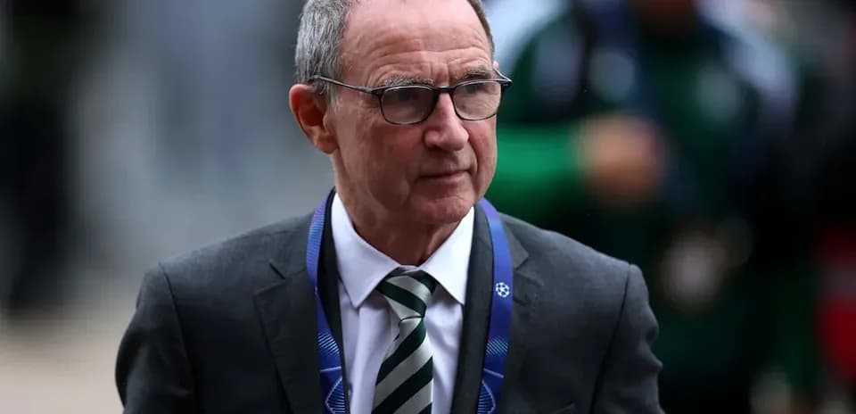 Man in suit arriving at a football event