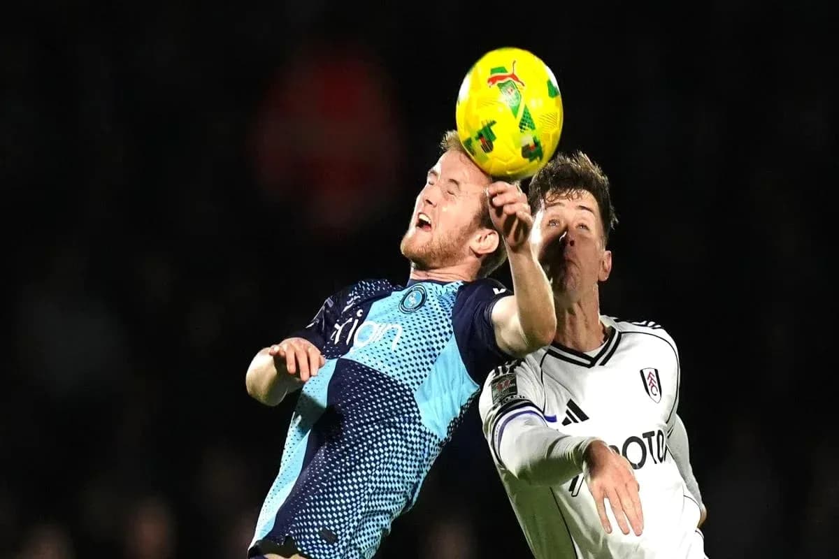 Two players contesting for the ball during match