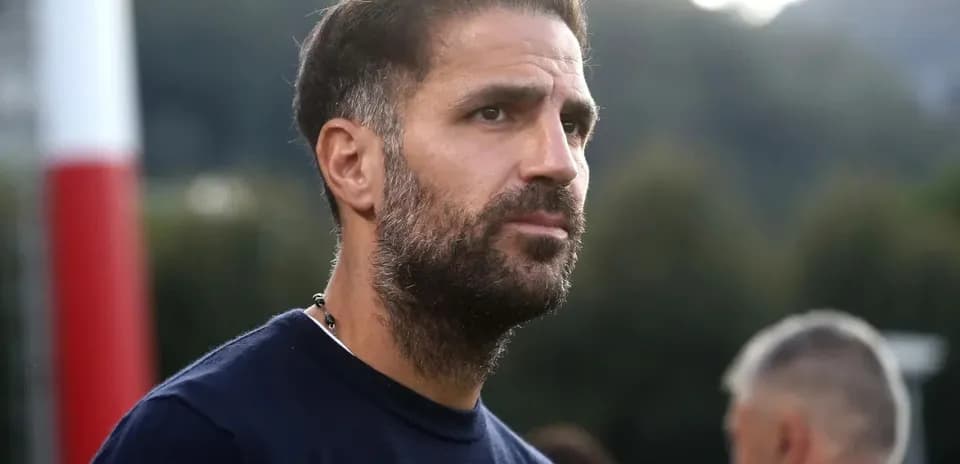 Man with beard observing training session outdoors