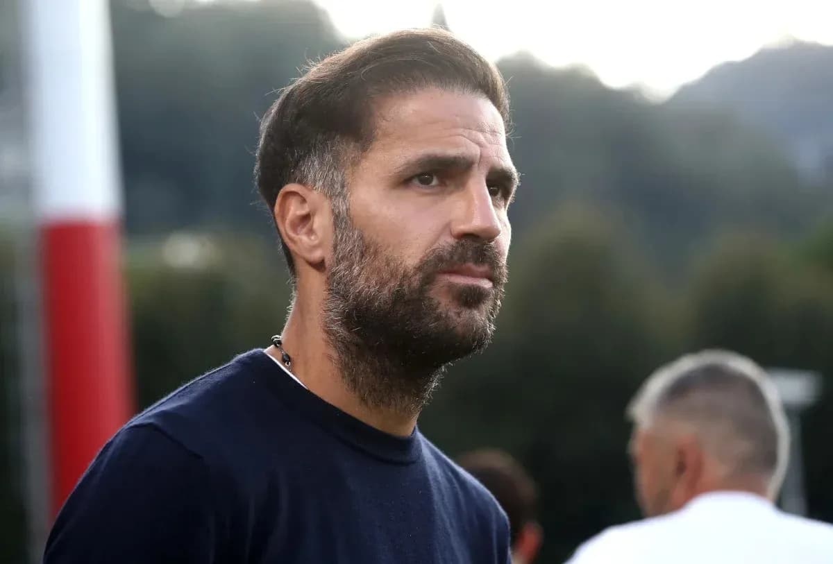 Man with beard observing training session outdoors