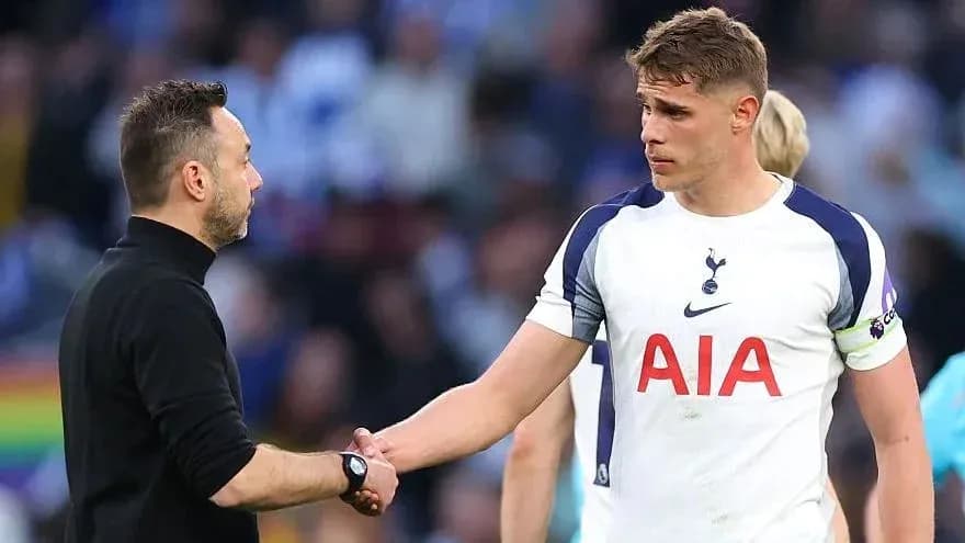 Manager and player shaking hands after match