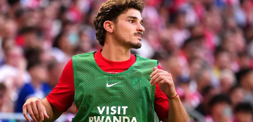 Player in training bib during match warm-up
