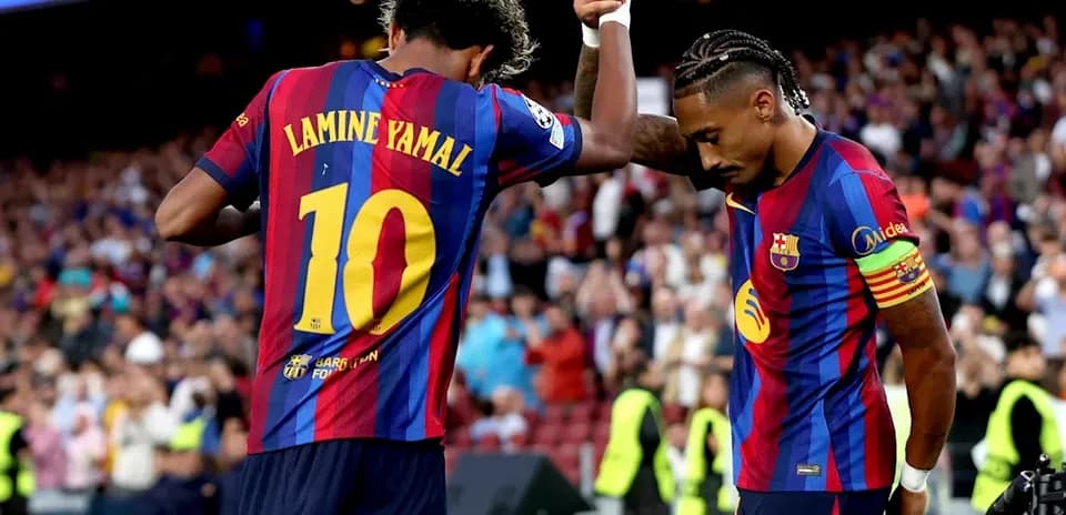 Lamine Yamal celebrating with teammate at Camp Nou