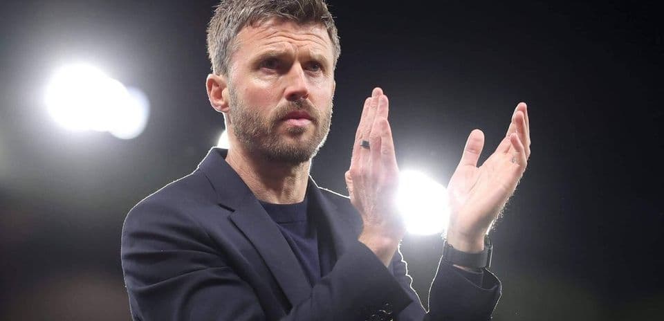 Coach applauding during a night match