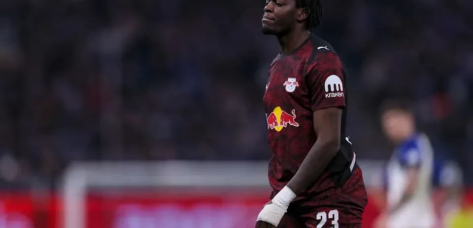 Player in RB Leipzig kit walking on field