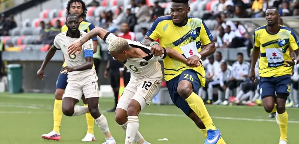 Players battling for the ball in CAF Champions League match