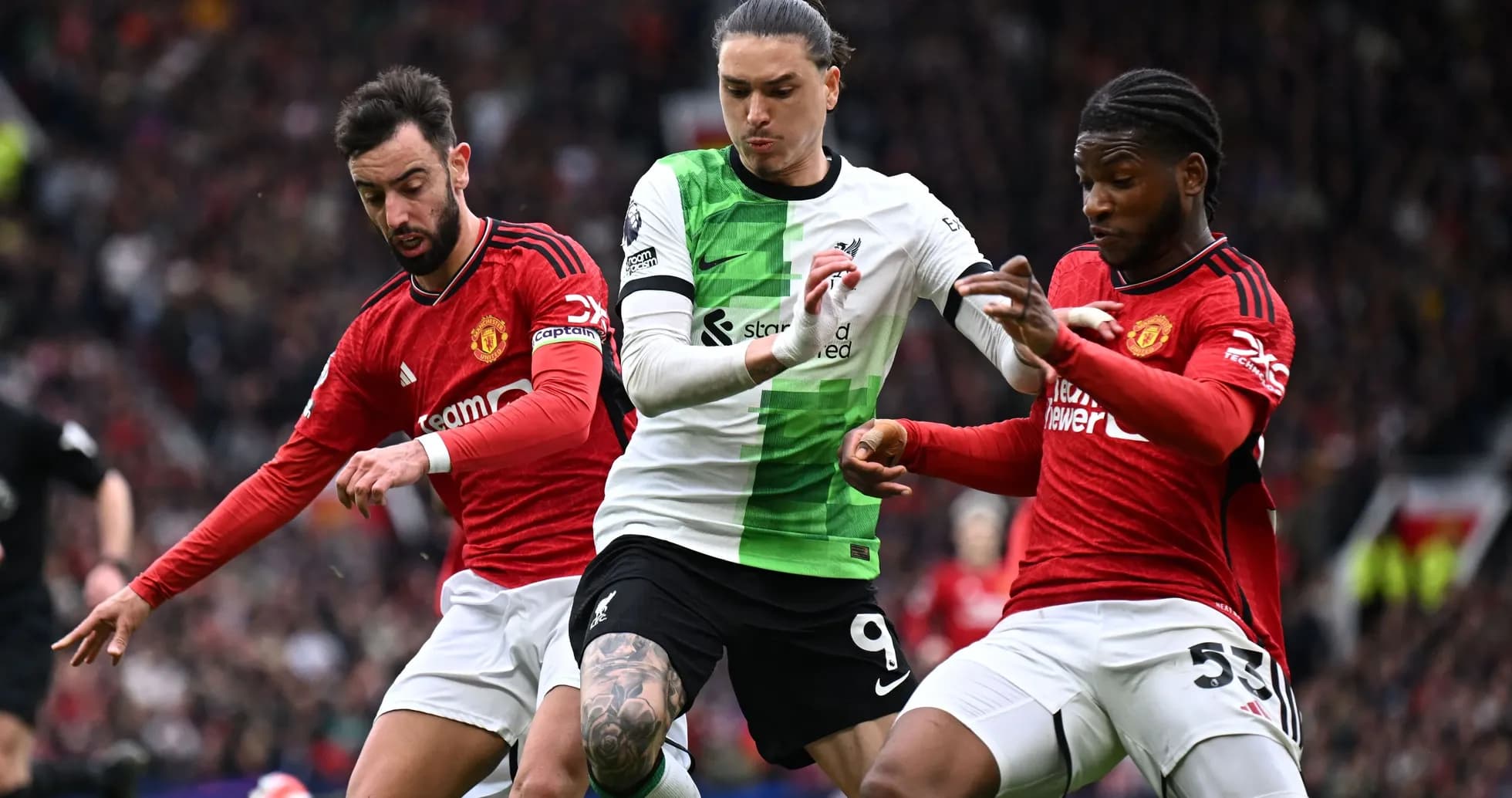 Players contesting the ball during Manchester derby