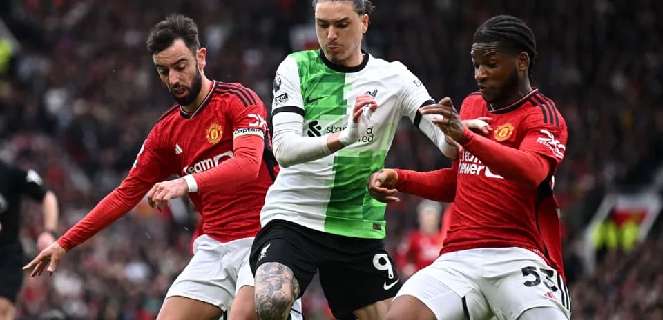 Players contesting the ball during Manchester derby