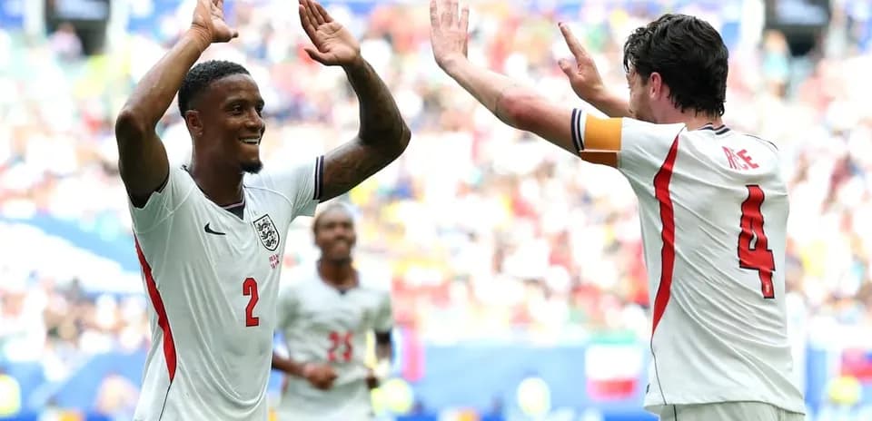 Two players celebrating a goal on the field