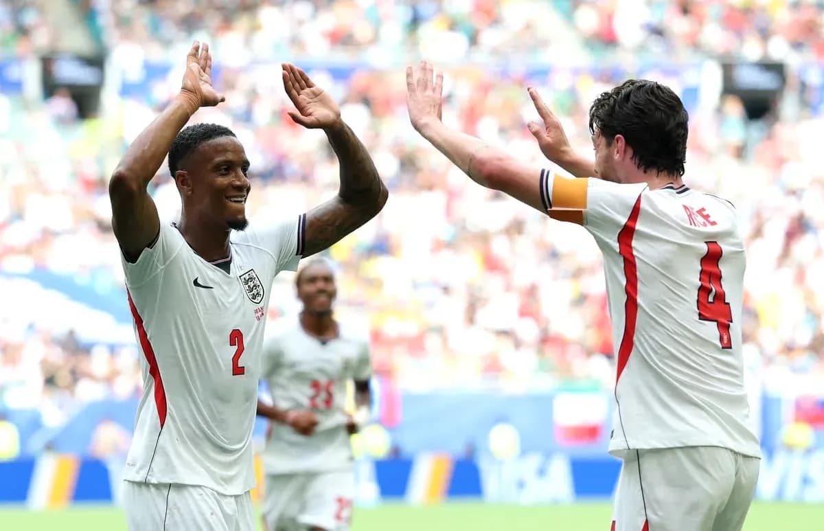 Two players celebrating a goal on the field