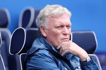 Coach sitting pensively on the bench