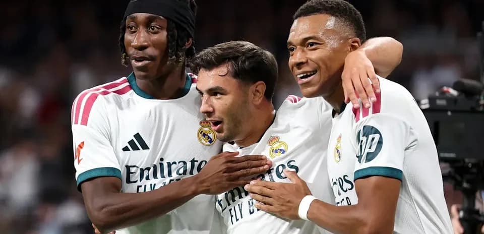 Three Real Madrid players celebrating together