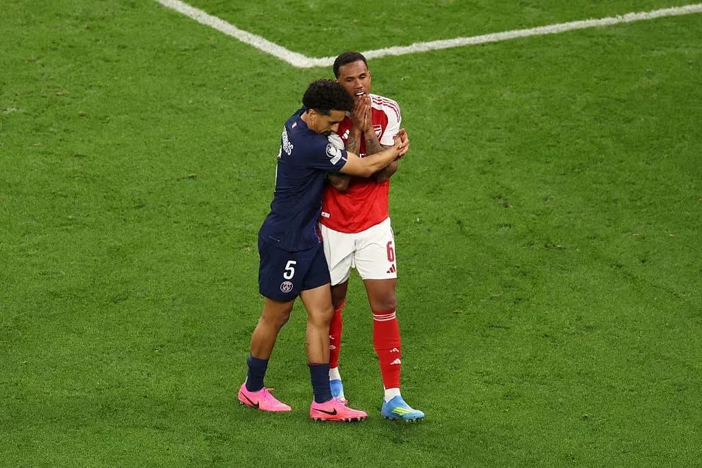 Two players embracing on the football pitch