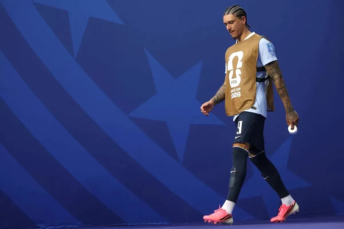 Player walking on pitch wearing training bib