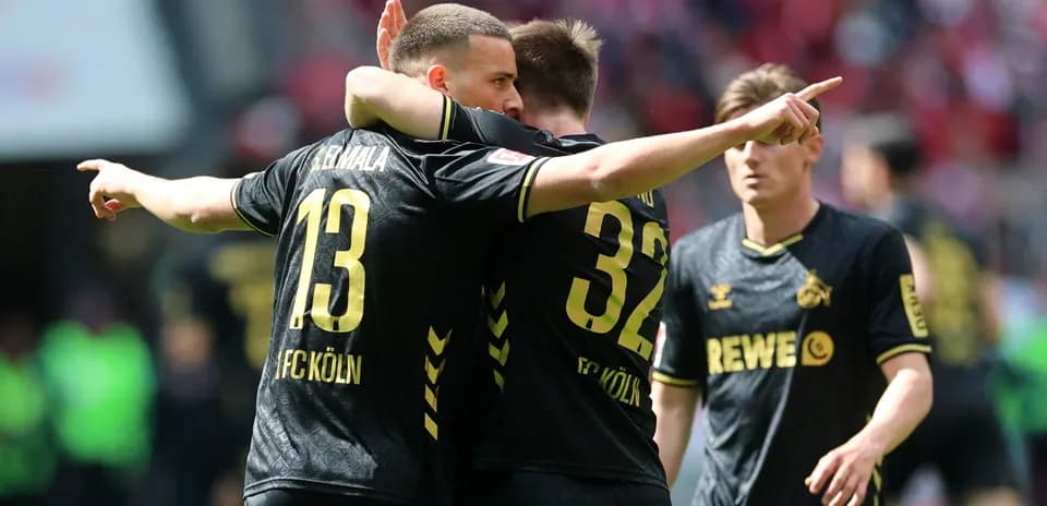 Players celebrating during a match for FC Köln