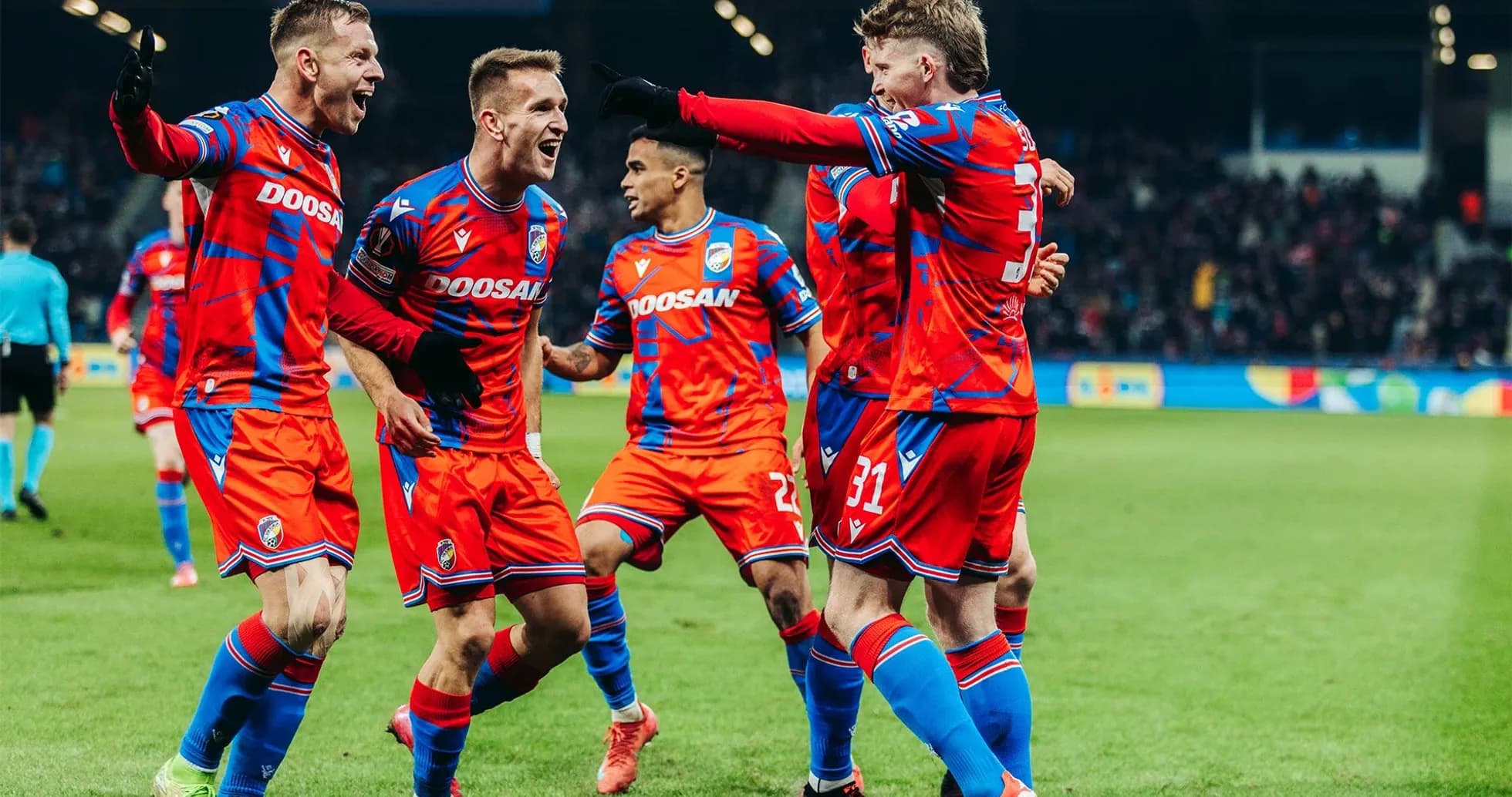 Players celebrating a goal during match