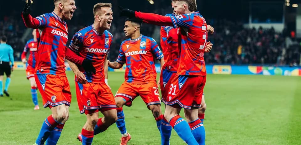 Players celebrating a goal during match