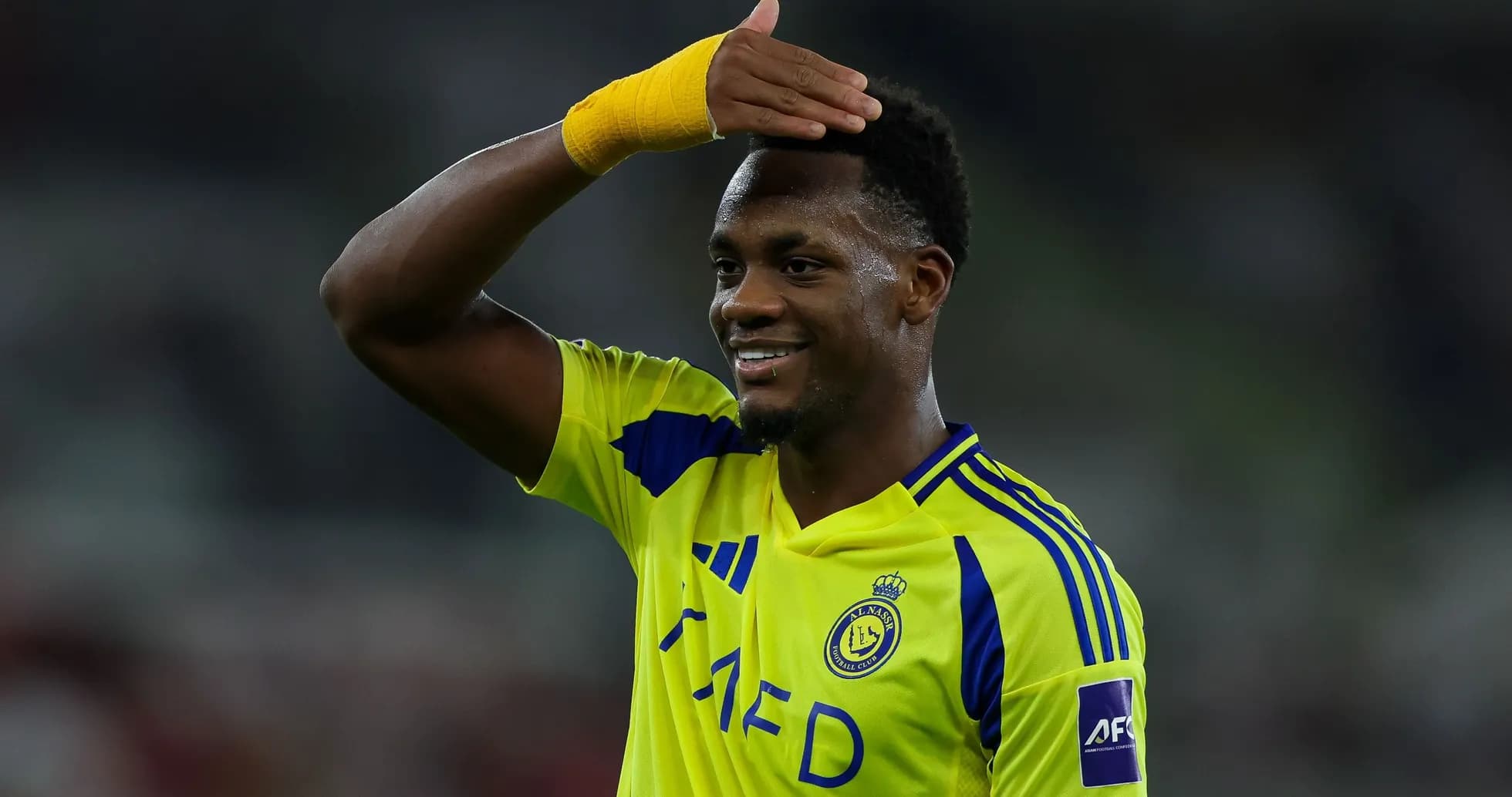 Player celebrating in bright yellow team jersey