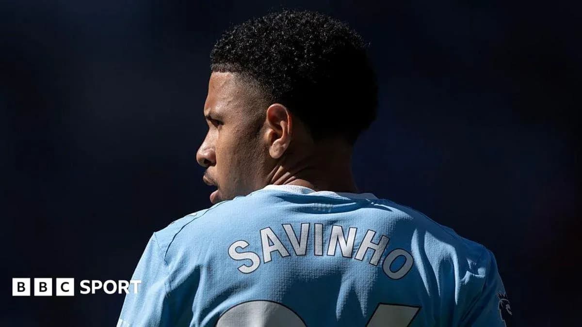 Player wearing jersey with name Savinho during match