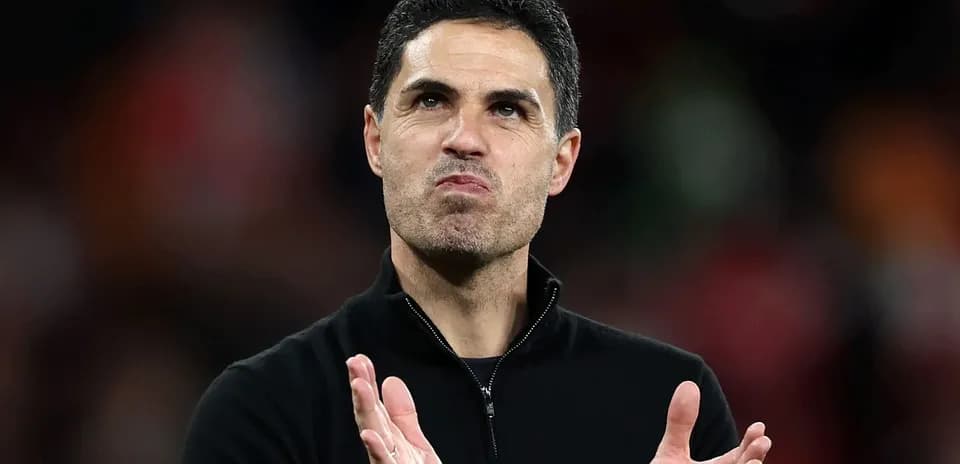 Manager clapping after match in stadium