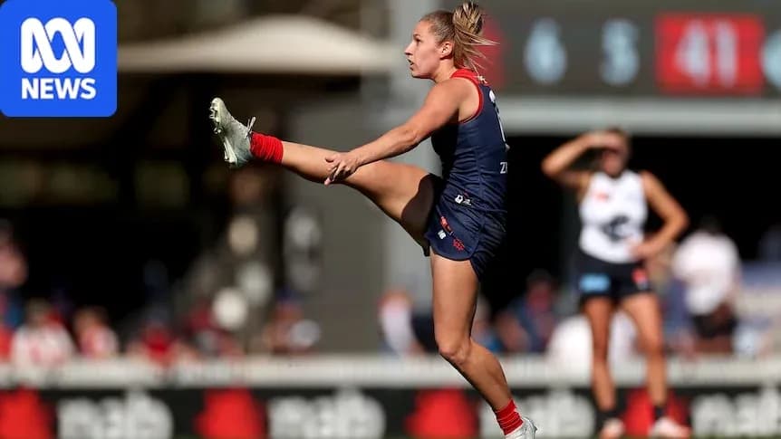 Player kicking the ball during Australian rules football match