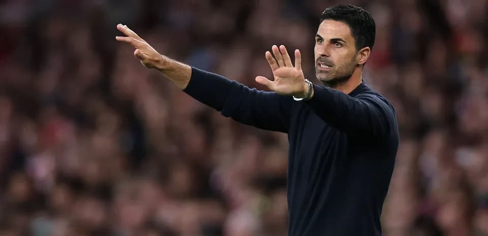 Manager gesturing on the sidelines during match