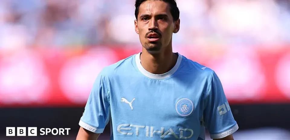 Player in light blue jersey during match warm-up
