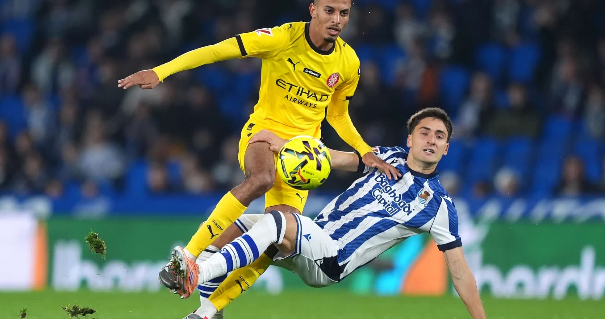 Player battling for the ball during Girona match