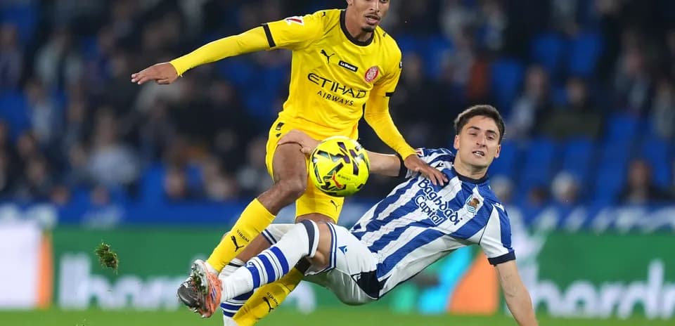 Player battling for the ball during Girona match