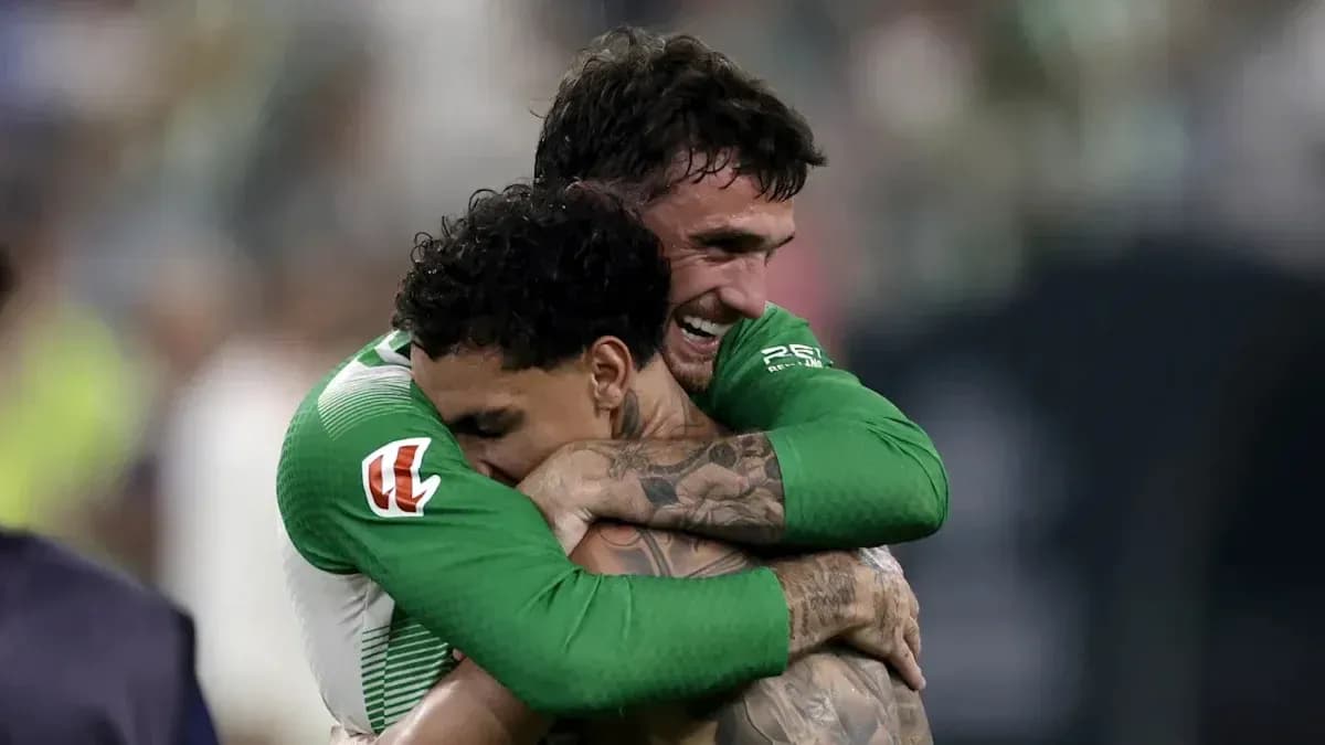 Two players embracing after a match victory