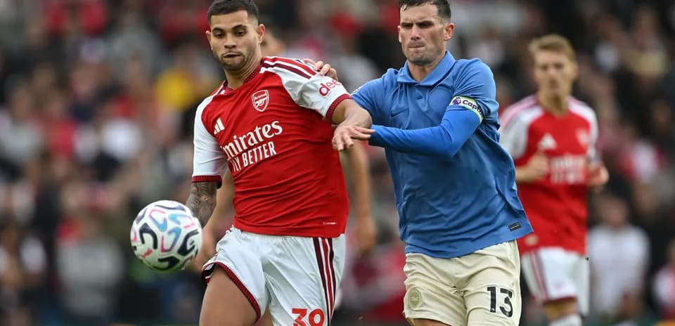 Two players battling for the ball during match