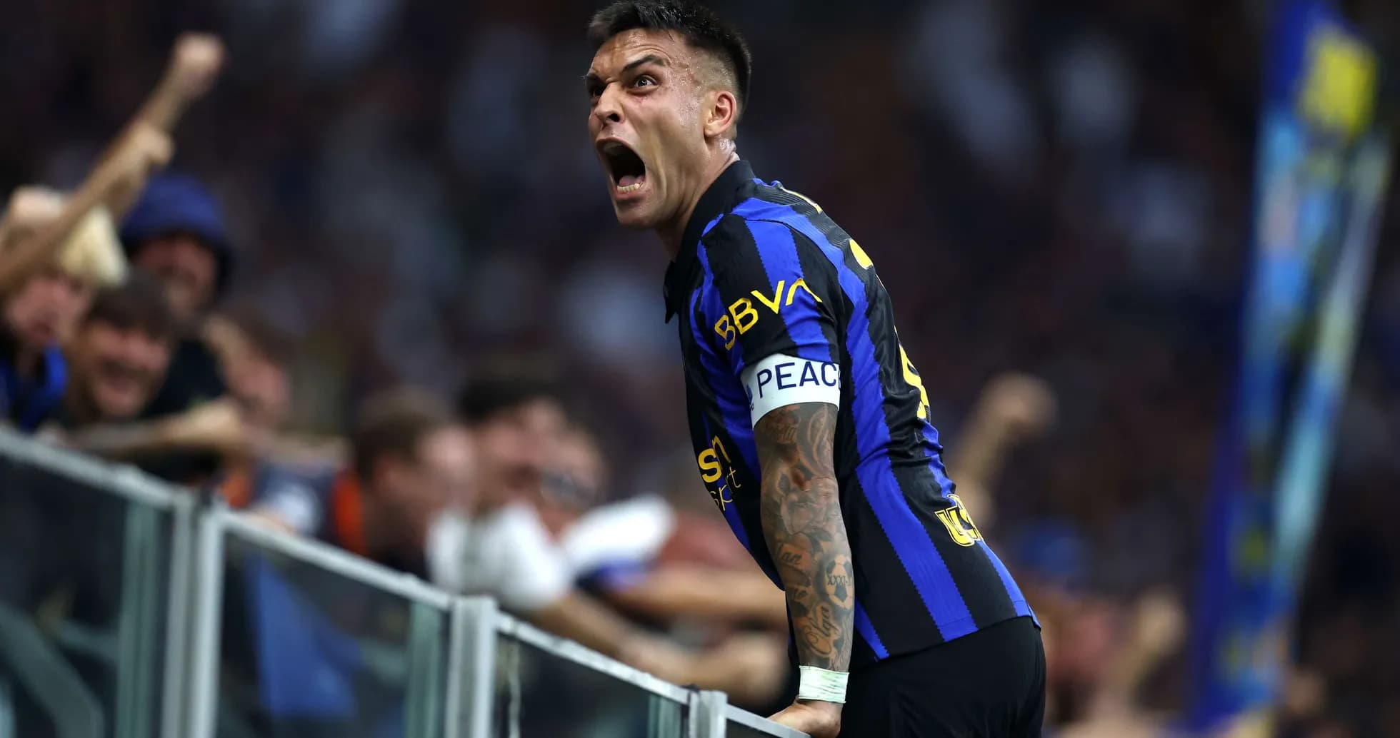 Lautaro Martínez celebrating with fans during match
